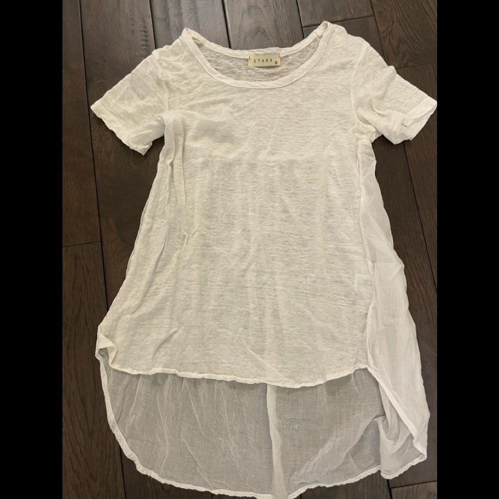 Stark white tee with sheer fabric in back.